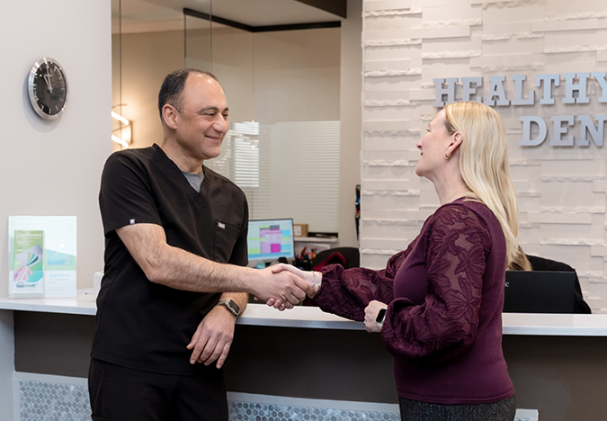 Doctor Tabbah shaking hands with a patient