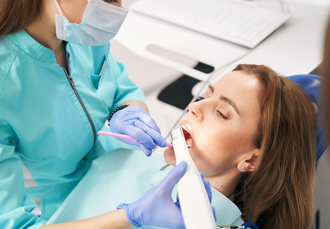 Dental patient getting photos taken of her teeth