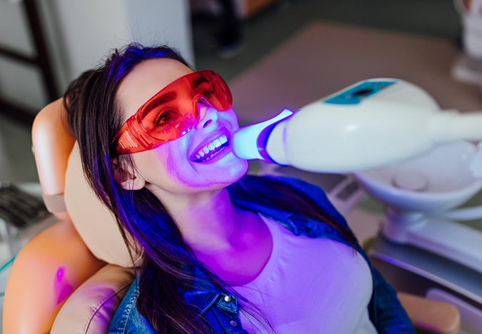 Dental patient getting her teeth professionally whitened