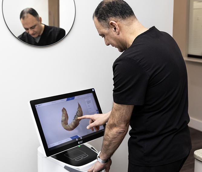 West Bridgewater emergency dentist looking at a scan of a patient's teeth