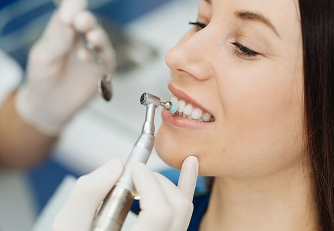 Dental patient getting her teeth cleaned