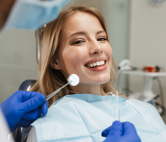 Smiling woman in the dental chair